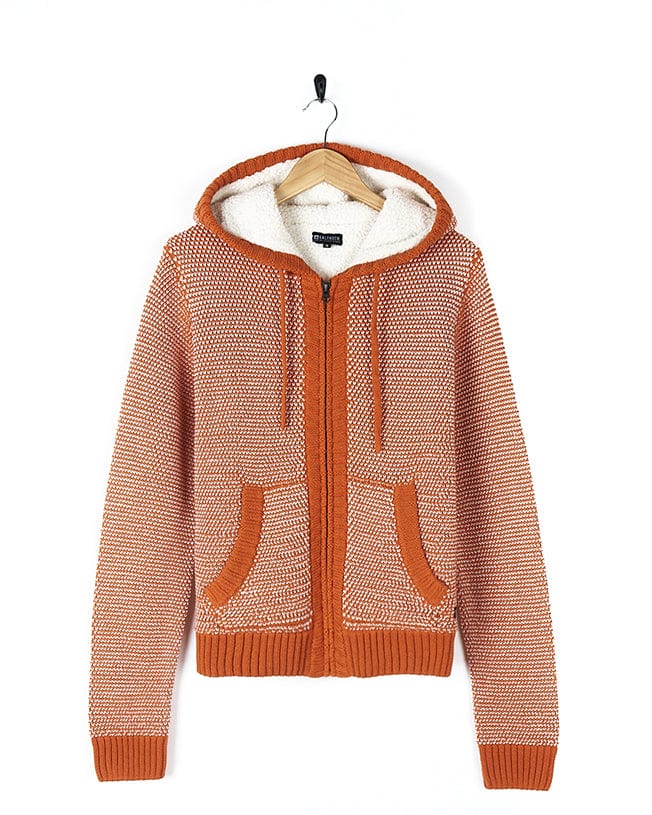 A Saltrock Helly - Womens Borg Lined Knitted Hoodie - Orange hanging on a hanger.