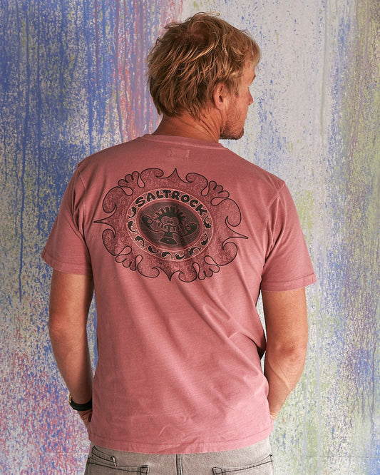The back of a man wearing a Saltrock Heraldic Tok - Limited Edition 35 Years T-Shirt.