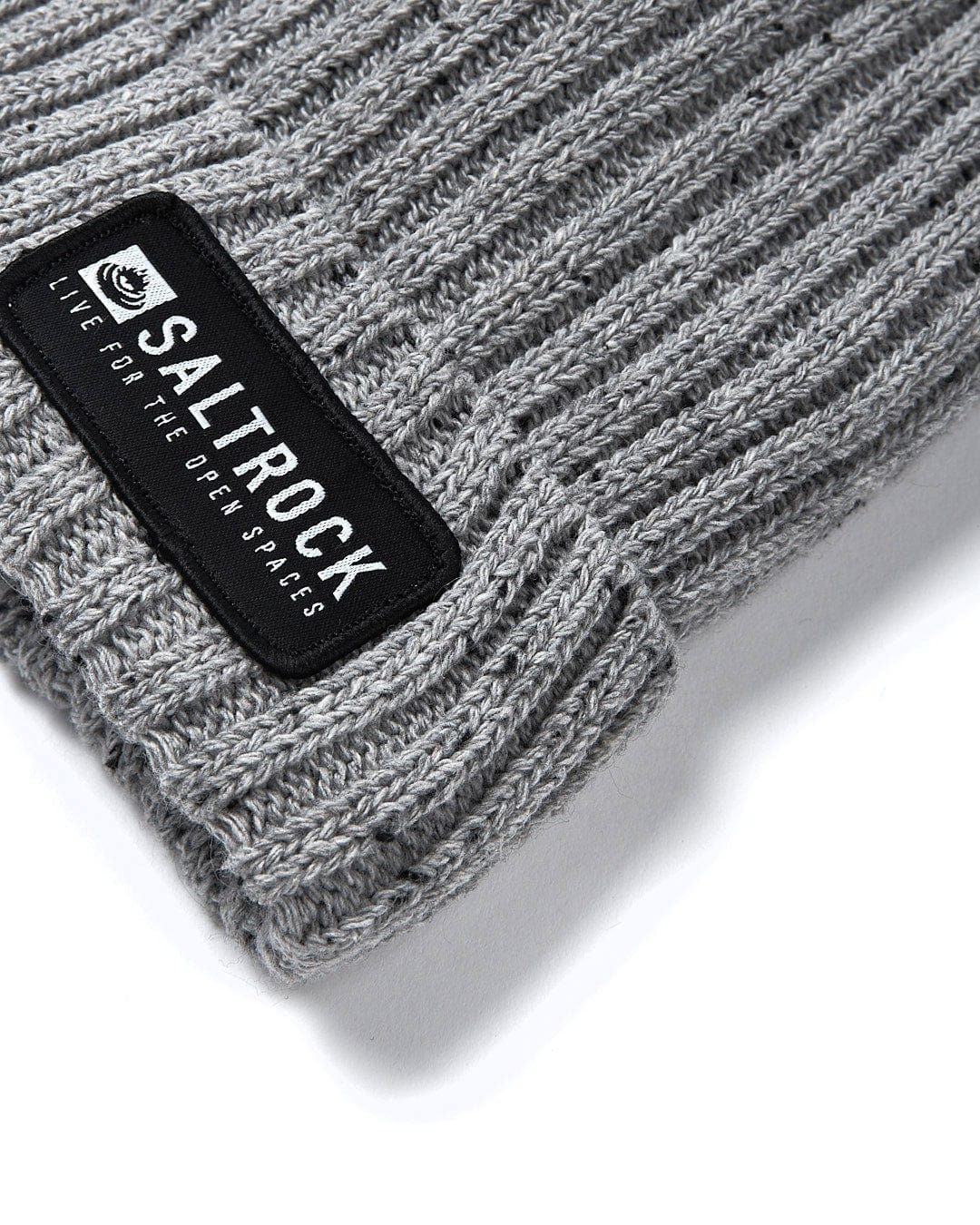 A chunky knit Heritage - Beanie - Grey with a Saltrock label, providing extra warmth.