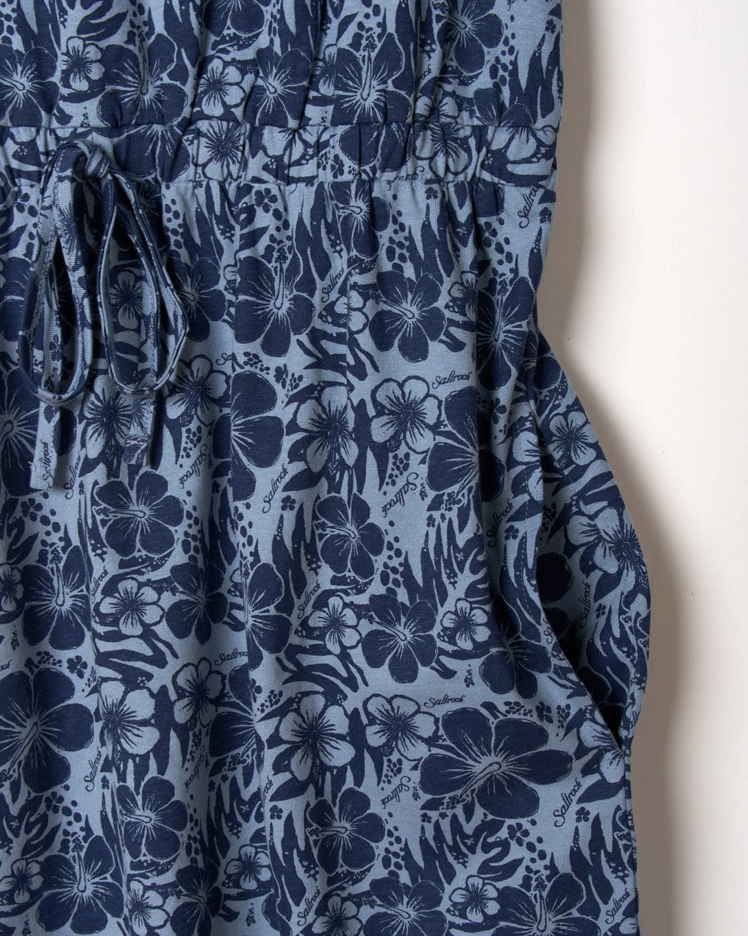 Blue floral fabric with gathered detail and drawstring, featuring a close-up of the Hibiscus Bauhaus pattern and texture by Saltrock.