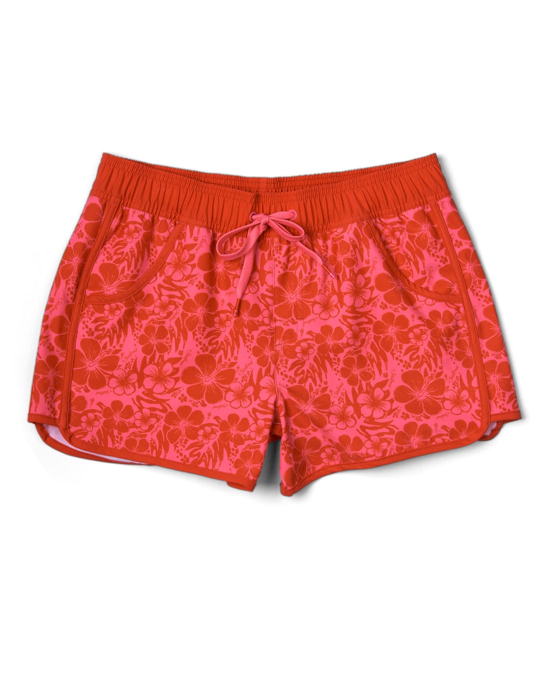 These Saltrock Hibiscus women's boardshorts feature a vibrant red and pink floral print design. Made with Repreve recycled material, they offer 4 way stretch for added comfort.