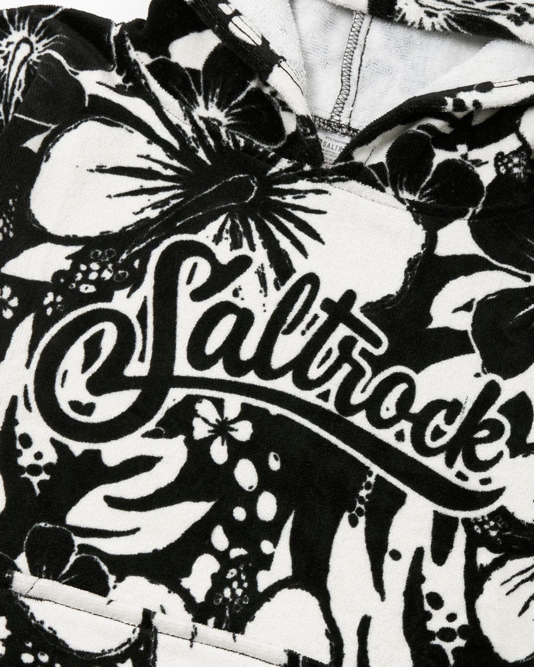 Close-up of an ultra-absorbent Hibiscus - Kids Changing Towel - Black/White with the word 
