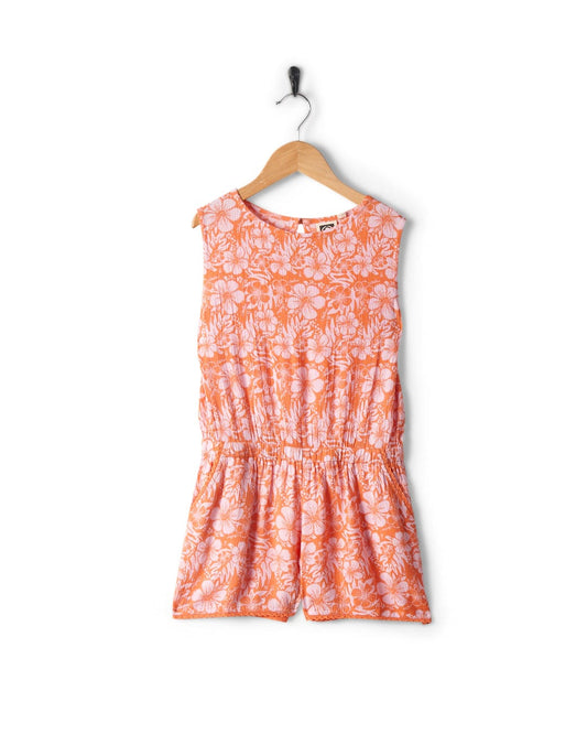 Pink/Orange hibiscus - Kids Playsuit by Saltrock hanging on a black hanger against a white background.