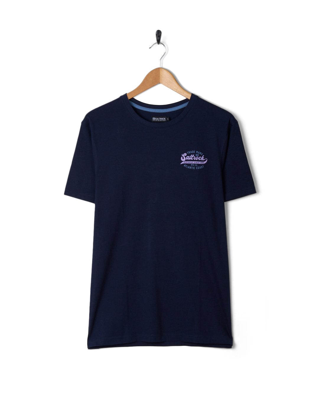 Dark blue Saltrock Home Run t-shirt on a hanger against a white background.
