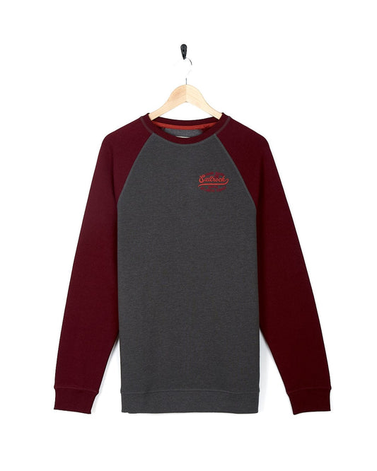 A Saltrock Home Run - Mens Long Sleeve Sweat - Grey/Red with contrasting red sleeves displayed on a hanger.