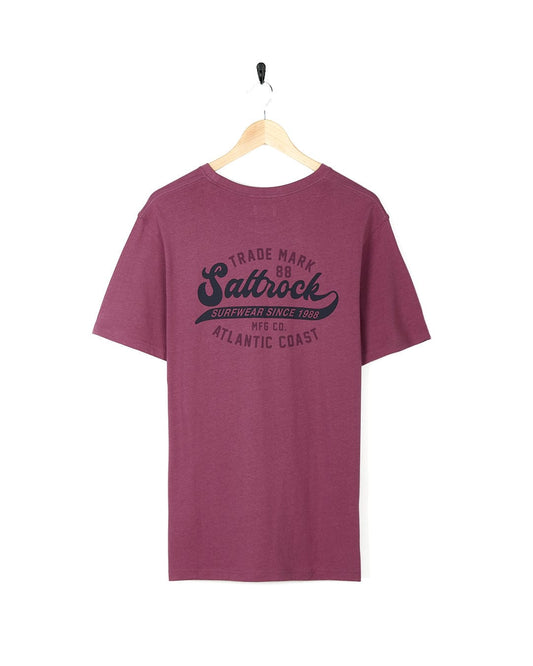 A vintage-inspired Home Run - Mens Short Sleeve T-Shirt - Dark Pink by Saltrock, perfect for surf wear with the words saltwater coast.