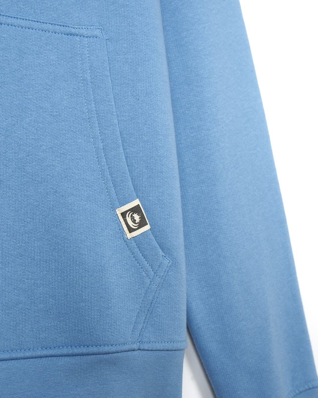 The back of a Saltrock Original 20 - Mens Pop Hoody - Light Blue with a logo on it.
