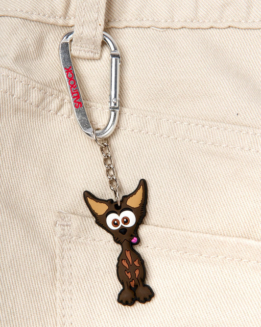 A brown chihuahua is hanging from the pocket of a pair of jeans using a Saltrock Jack Keyring.