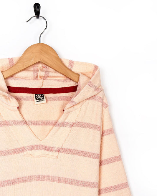 A Saltrock Kennedy - Kids Pop Hoodie - Pink, featuring pink stripes, hanging on a wooden hanger.