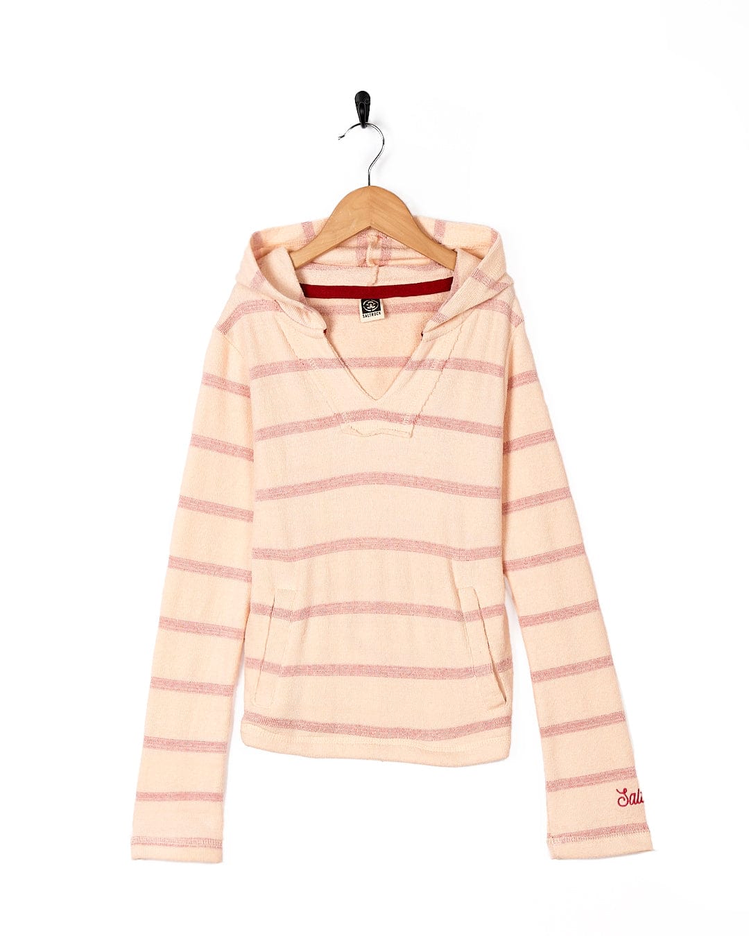 A girl's Kennedy - Kids Pop Hoodie - Coral by Saltrock hanging on a hanger.