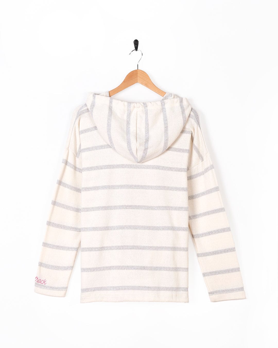 A Saltrock Kennedy - Womens Pop Hoodie - Cream, white and grey striped hoodie hanging on a wooden hanger.