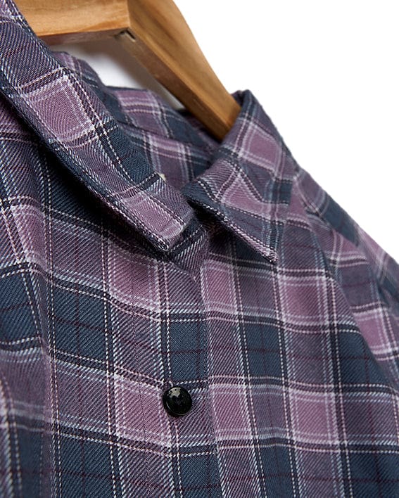 A relaxed-fit, Kizzie - Womens Check Boyfriend Shirt - Purple in Saltrock brand, purple and black checkered boyfriend shirt hanging on a wooden hanger.