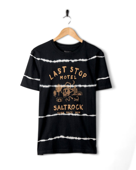 Black and white striped t-shirt with Saltrock branding, hanging on a wall-mounted hanger against a white background.