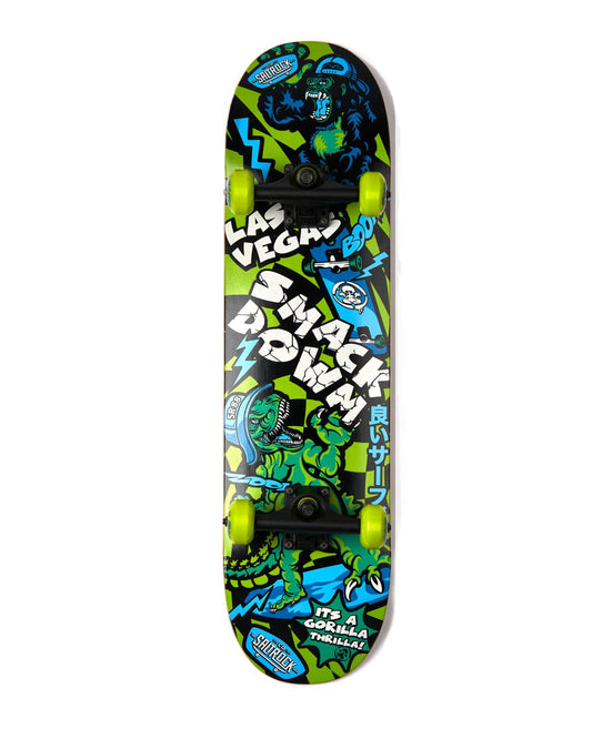 This durable and colorful skateboard, the Las Vegas Smackdown - Skateboard - Green/Blue by Saltrock, features neon green wheels and a graphic design with text reading "Las Vegan Snack Down." The deck board showcases a cartoon-style gorilla amid vibrant blue/green elements, making it as eye-catching as it is sturdy.