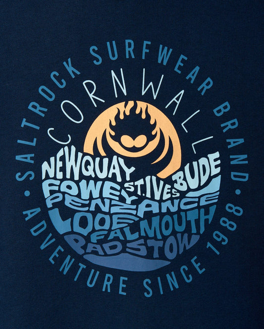 Graphic print of a sun logo with text promoting Saltrock surfwear, naming Newquay, St Ives, Bude, and Falmouth, with the tagline "Adventure since 1988