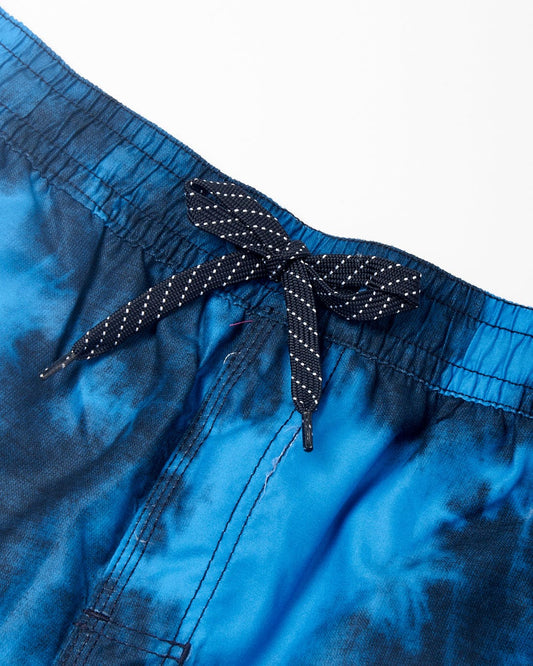 Close-up of Saltrock's Lee - Mens Tie Dye Swimshorts - Blue with a polka dot drawstring tied in a bow.