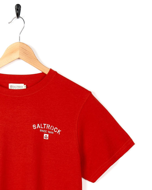 A Stencil - Mens Location T-Shirt - Croyde - Red with the brand name Saltrock on it.