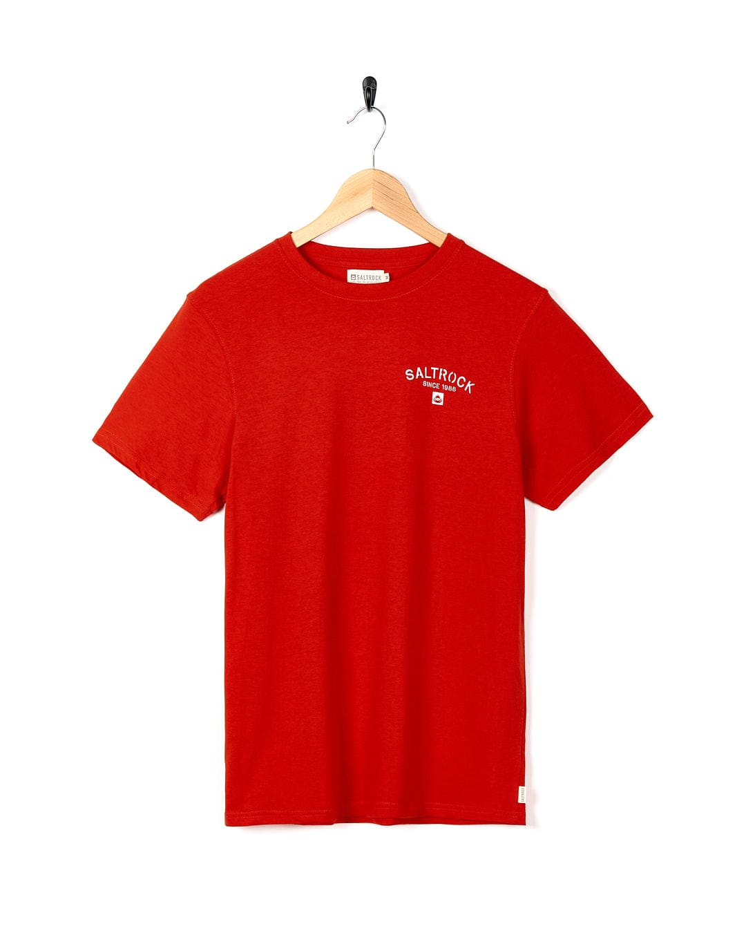 A Saltrock Stencil - Mens Location T-Shirt - Woolacombe - Red with a white logo on it.