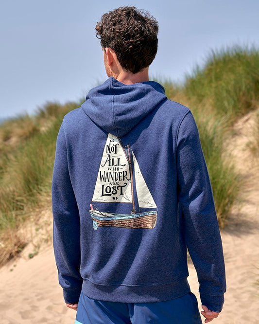 The back of a man wearing a Saltrock Lost Ships - Mens Pop Hoodie - Dark Blue with a sailboat on it.
