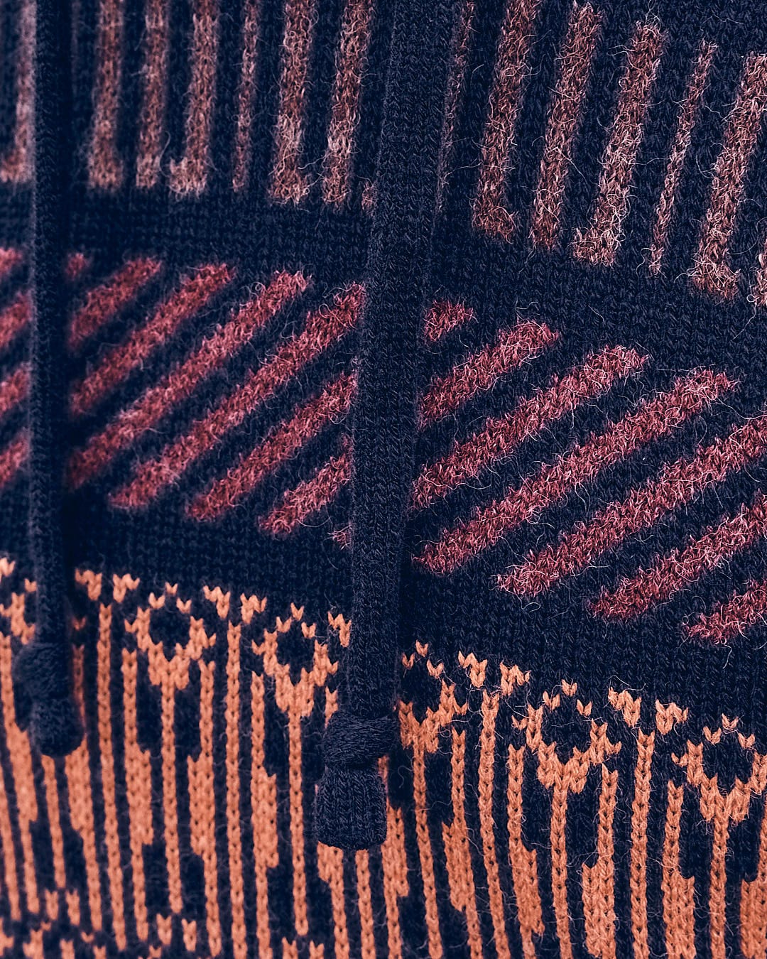 A close up of a Saltrock "Lukas - Mens Knitted Hoodie - Dark Blue" sweater.