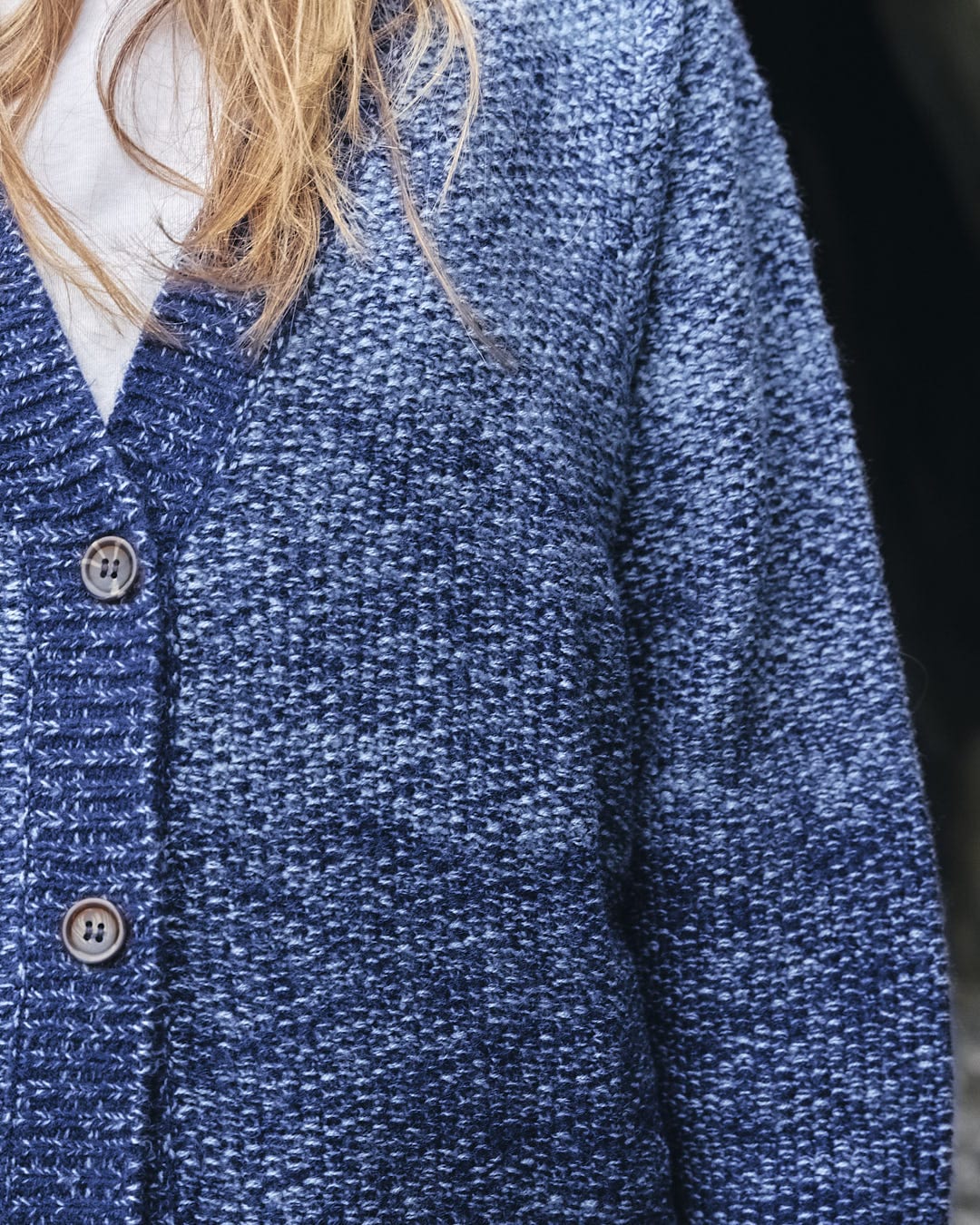 A woman wearing a Saltrock Lynton - Womens Button Cardigan - Dark Blue.