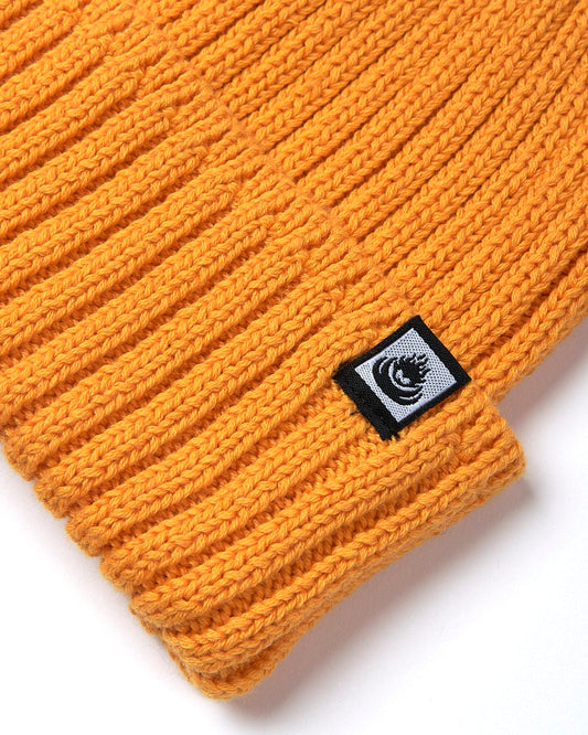 A Maine - Fisherman Beanie - Yellow by Saltrock on a white surface.