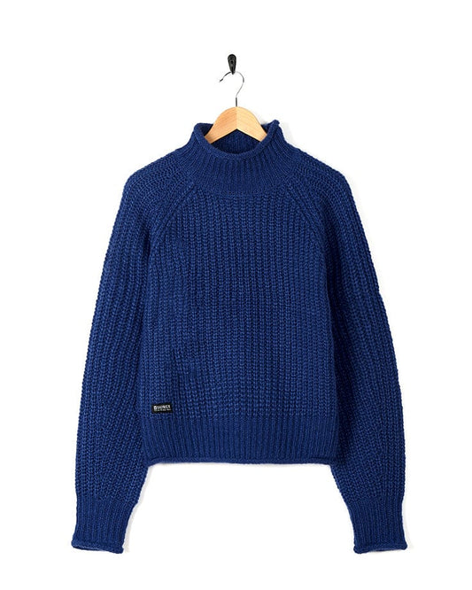 A Saltrock Mandy - Womens Funnel Neck Jumper - Blue hanging on a hanger.