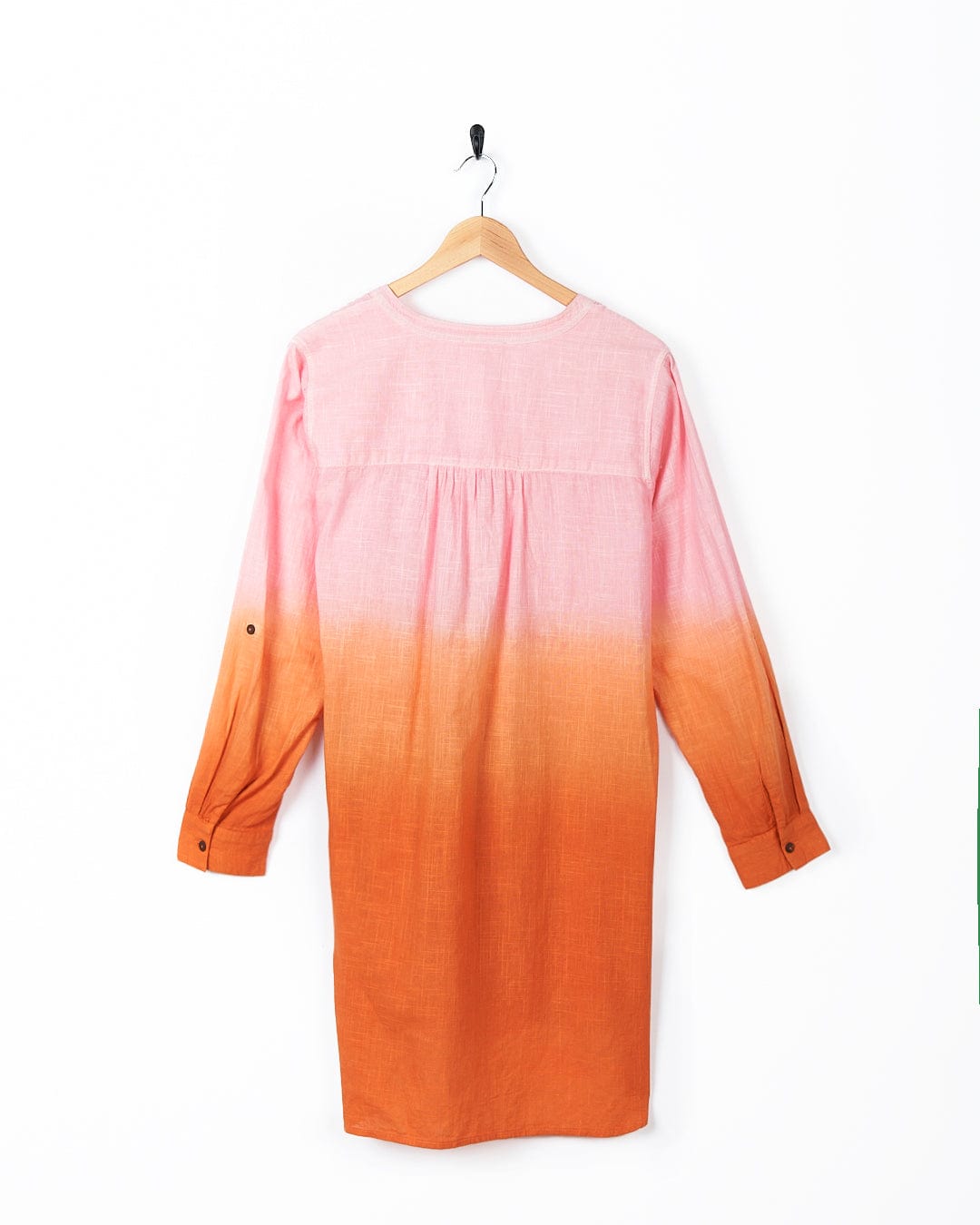 A Saltrock Manina - Womens Dip Die Beach Shirt - Orange and pink ombre dress hanging on a hanger.