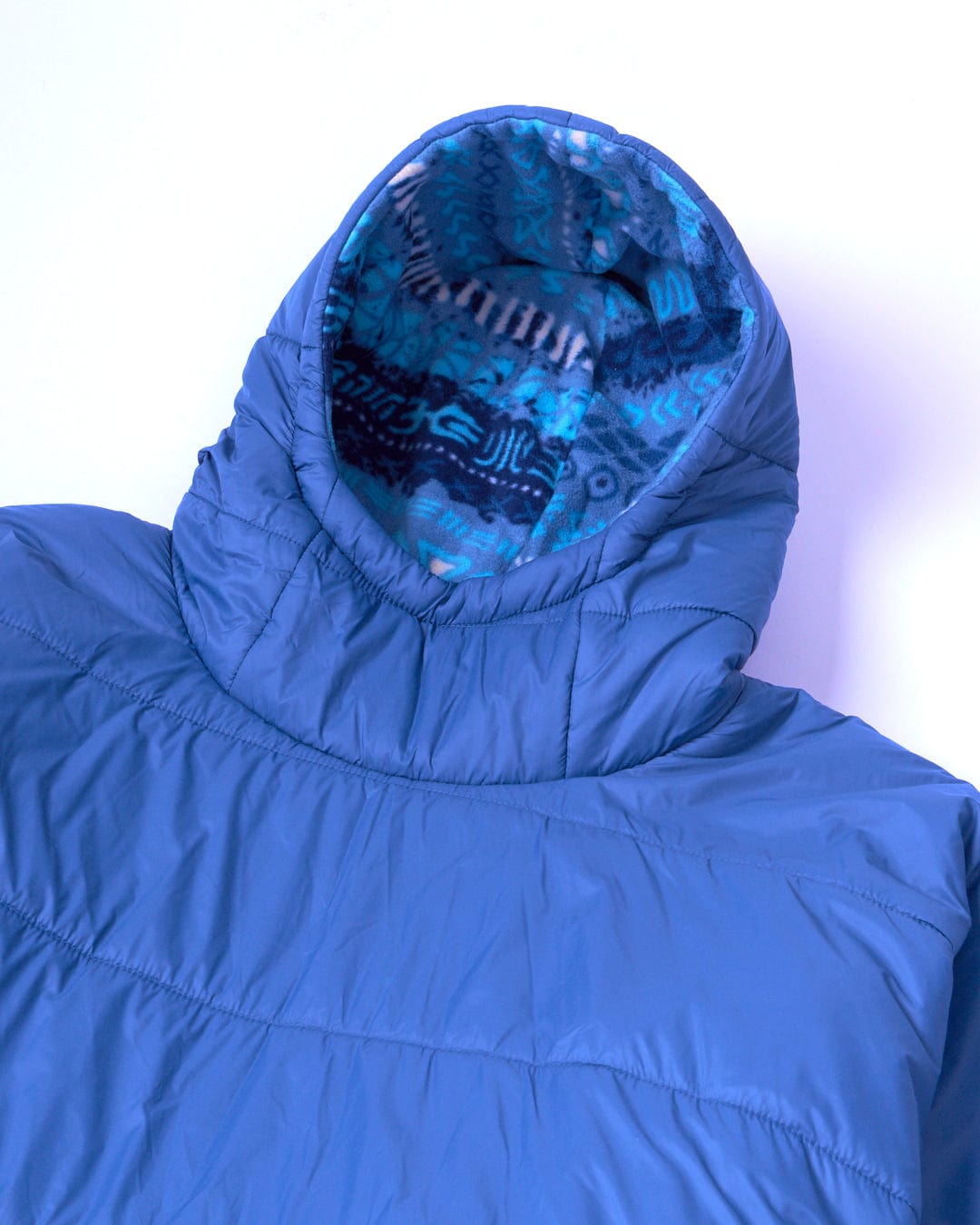 A water-resistant Saltrock blue hooded jacket made from recycled materials on a white surface.