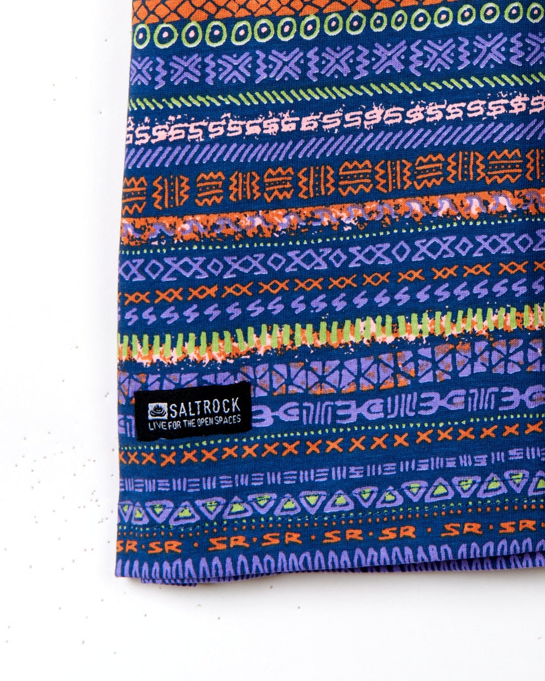 A colorful bag with an Aztec print and Saltrock branding on it.