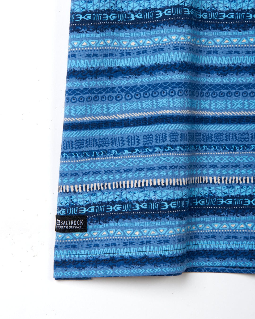A blue cotton towel with an Aztec print from Saltrock.