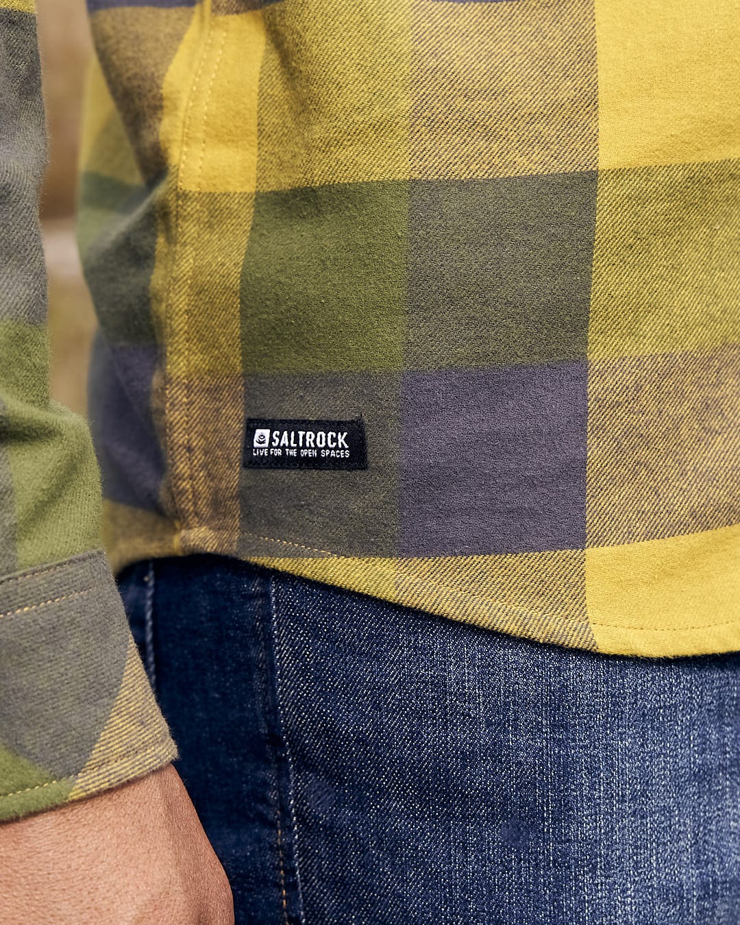 The back of a man wearing a Saltrock Mattie - Mens Long Sleeve Shirt - Yellow plaid shirt.