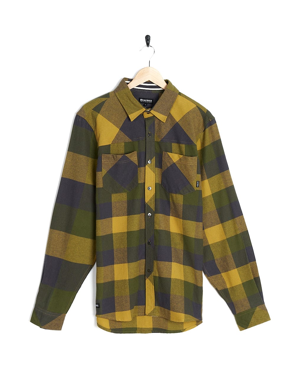 A yellow and black plaid Saltrock shirt hanging on a hanger.