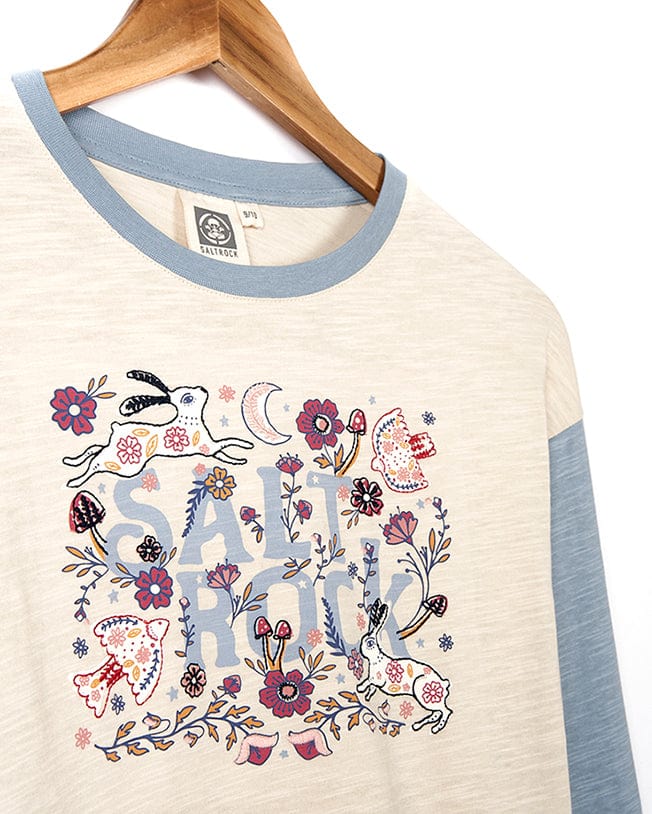 A comfortable fabric Meadow - Kids Long Sleeve Cropped T-Shirt - Cream with an embroidered floral Saltrock branded graphic.