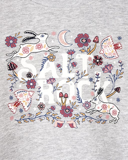 A Saltrock Meadow branded sweatdress featuring an illustration of a rabbit and flowers, combining comfort and style.