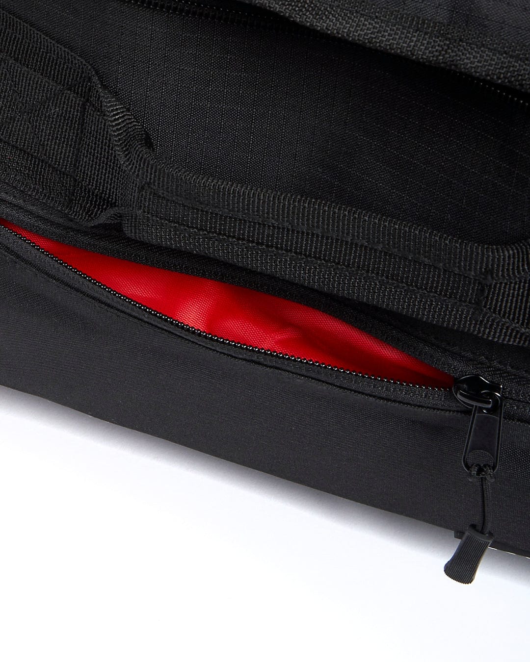 A Saltrock Mission - Holdall - Black duffel bag with a red zipper.