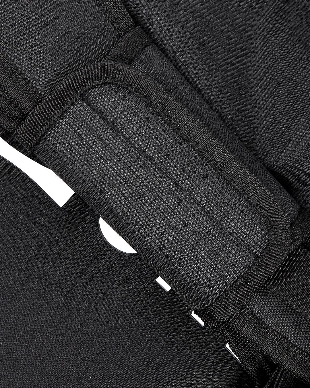 A close up of a Saltrock Mission - Holdall - Black backpack with a zipper.