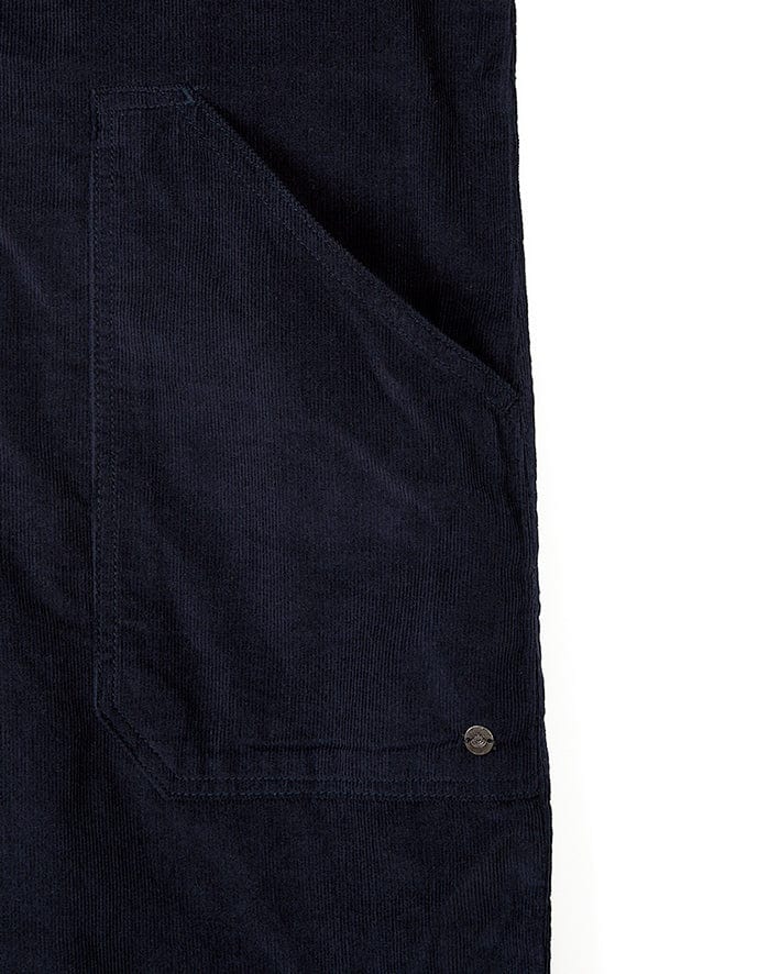 A close up of a fashion-conscious woman wearing a Saltrock Nancy - Womens Cord Dungaree - Dark Blue apron.