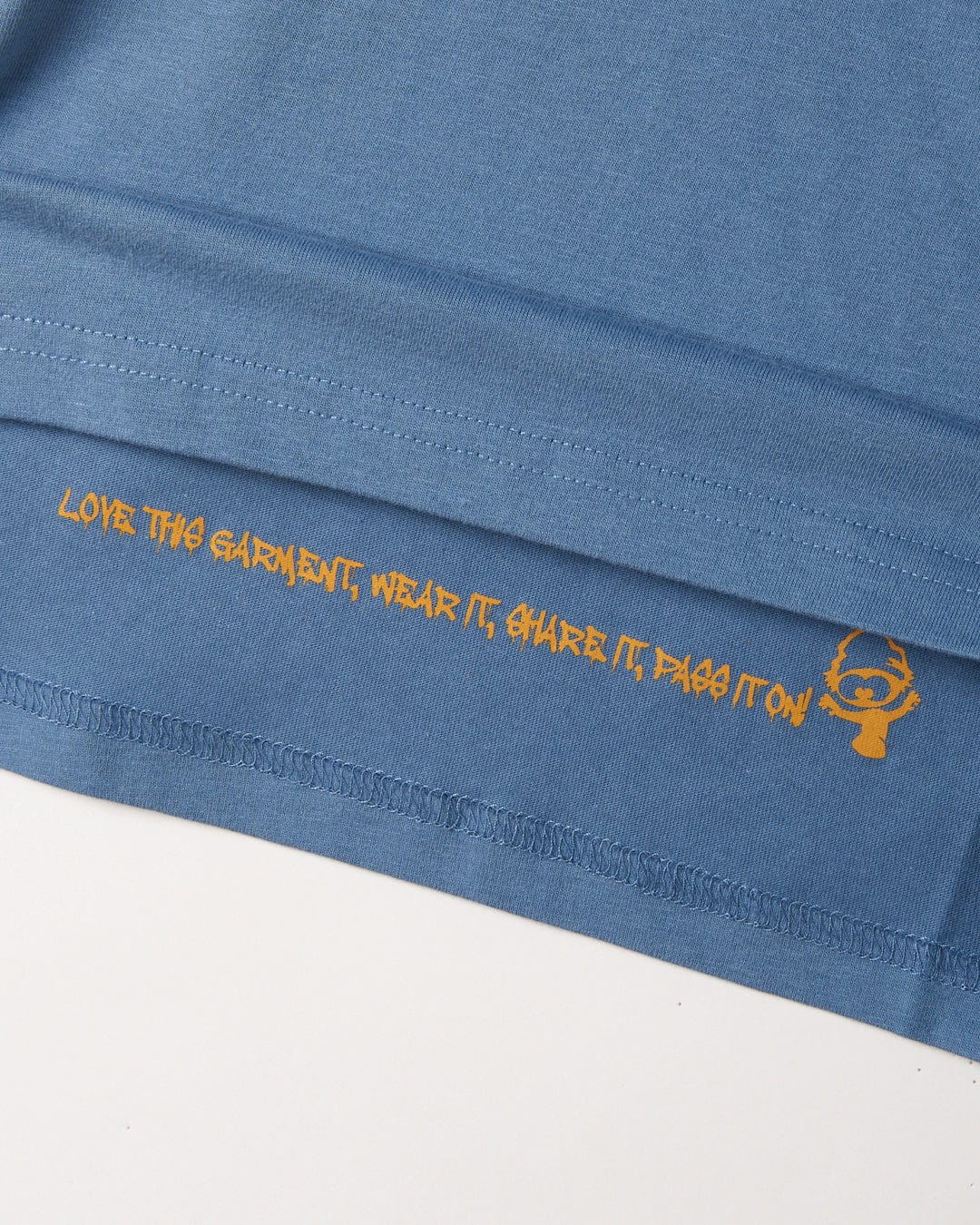 The back of a blue cotton No Road No Problem - Kids Short Sleeve T-Shirt with an orange Saltrock logo on it.
