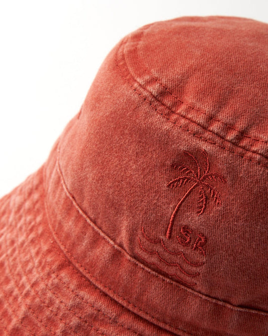 Close-up of a red cotton Palm Bucket Hat - Burnt Orange with an embroidered palm tree design by Saltrock.