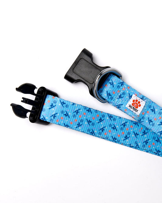 Saltrock Paw Print Dog Collar with quick-release buckle in blue webbing strap and an orange and blue pattern.