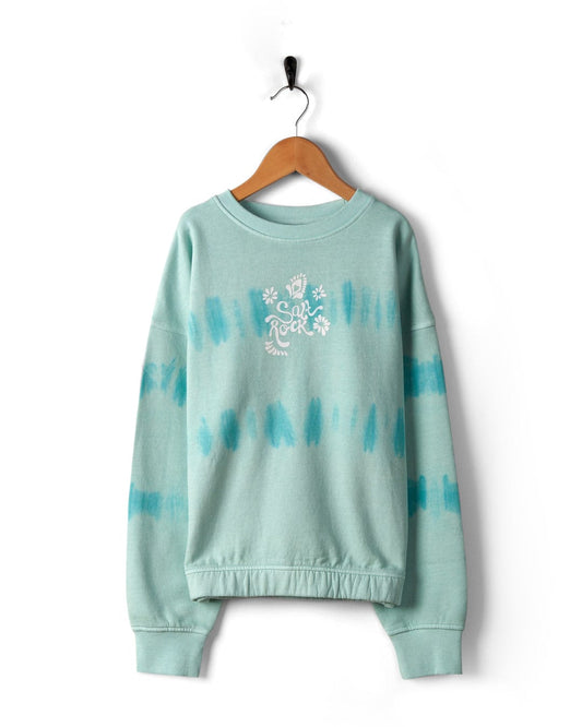 A Saltrock teal sweatshirt with a tie-dye stripe pattern and "sun & rock festival" graphic, displayed on a hanger against a white background.