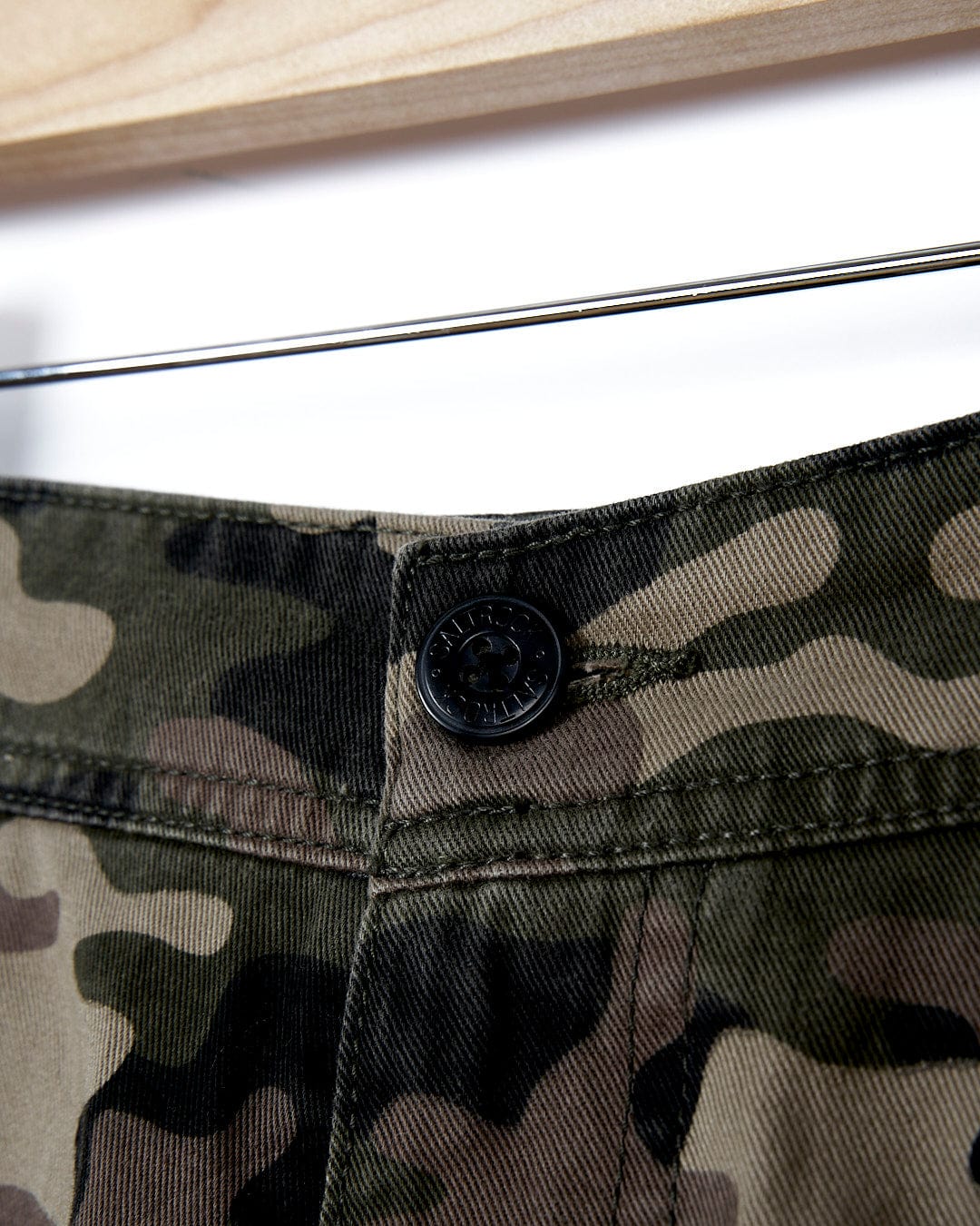 A close up of a pair of Saltrock Penwith II - Mens Cargo Short - Dark Green shorts.