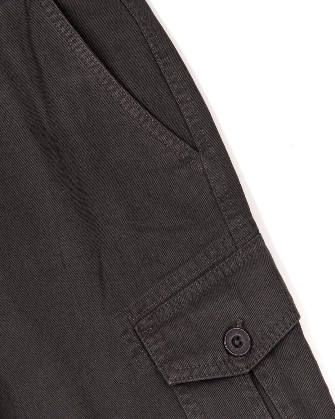 Close-up of a Penwith II - Men's Cargo Shorts - Dark Grey cuff with a button.