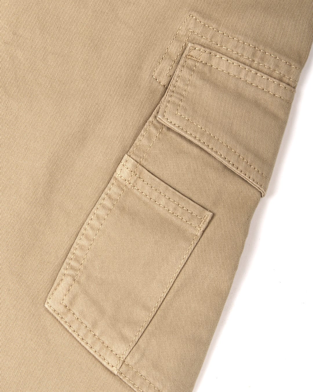 Close-up of Penwith II - Mens Cargo Shorts - Cream cotton material with a stitched pocket by Saltrock.
