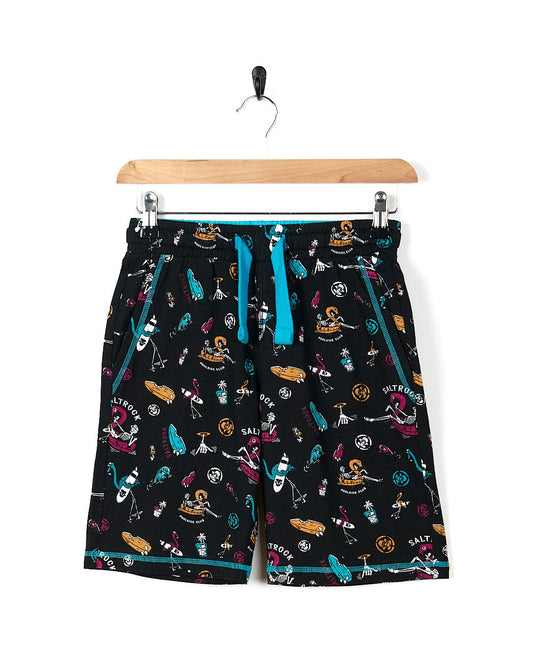 A Saltrock Poolside Mash - Kids All Over Sweat Short - Black with a colorful pattern on it.