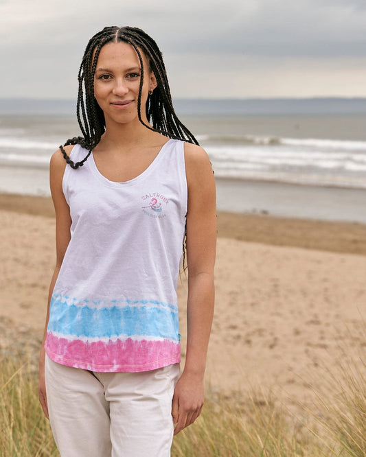 A woman standing on a beach wearing a Poolside - Womens Tie Dye Vest - White by Saltrock.