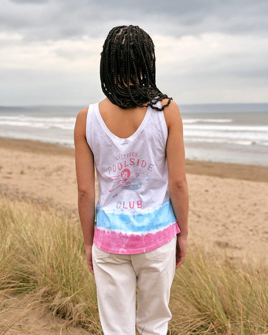 A woman standing on the beach wearing a Saltrock Poolside - Womens Tie Dye Vest - White.