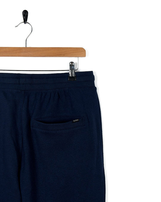 Saltrock Premium Helston - Mens Jogger - Dark Blue sweatpants hanging on a hanger, perfect for an active lifestyle.
