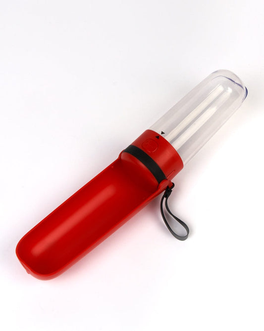 A Quench - Dog Water Bottle - Red container with a Saltrock handle for easy carrying.